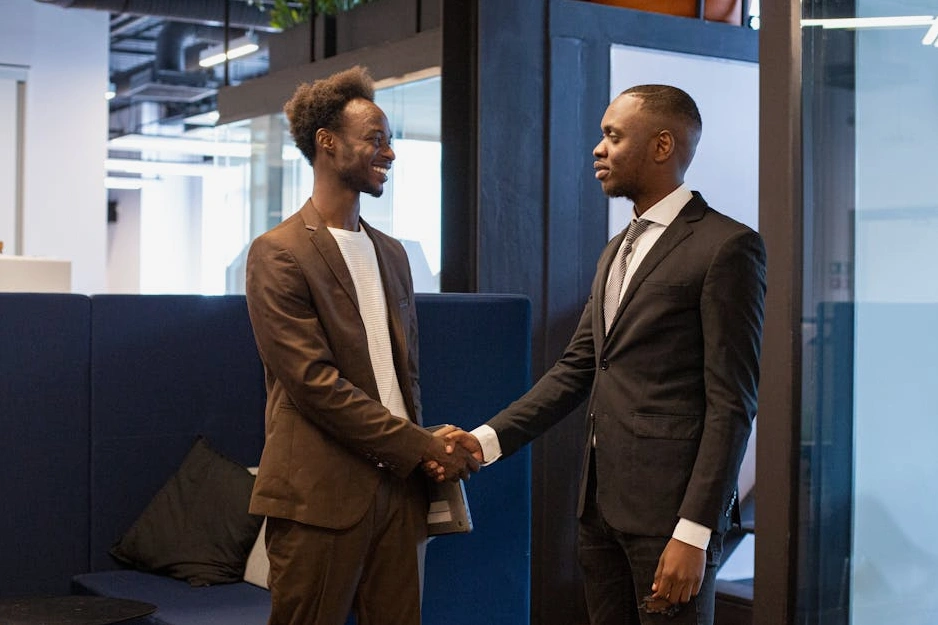 A handshake sealing a business deal in a modern office